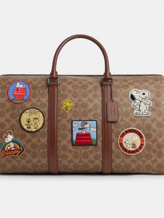Coach Handbags - Coach Brown Signature Duffel with Peanuts Character Patches